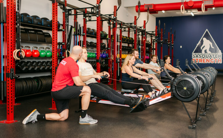 Sasquatch Strength coaches working with members in Redmond WA gym