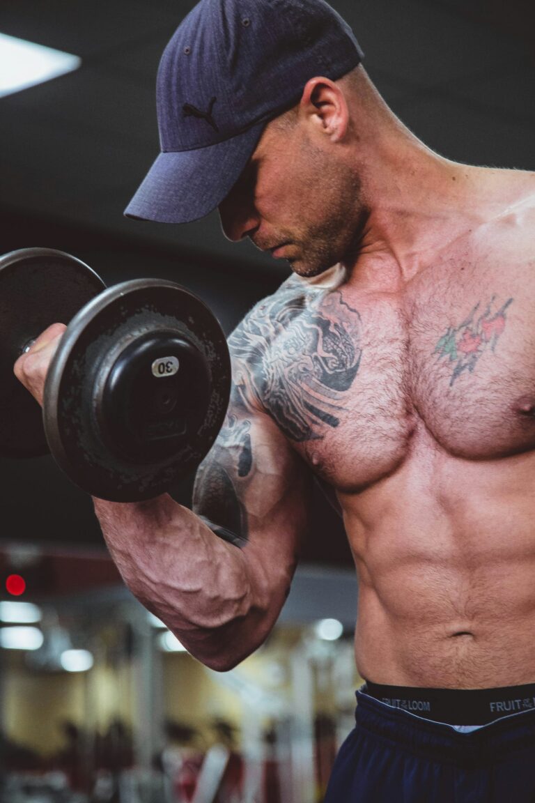 Man strength training with a dumbbell — testosterone optimization and training
