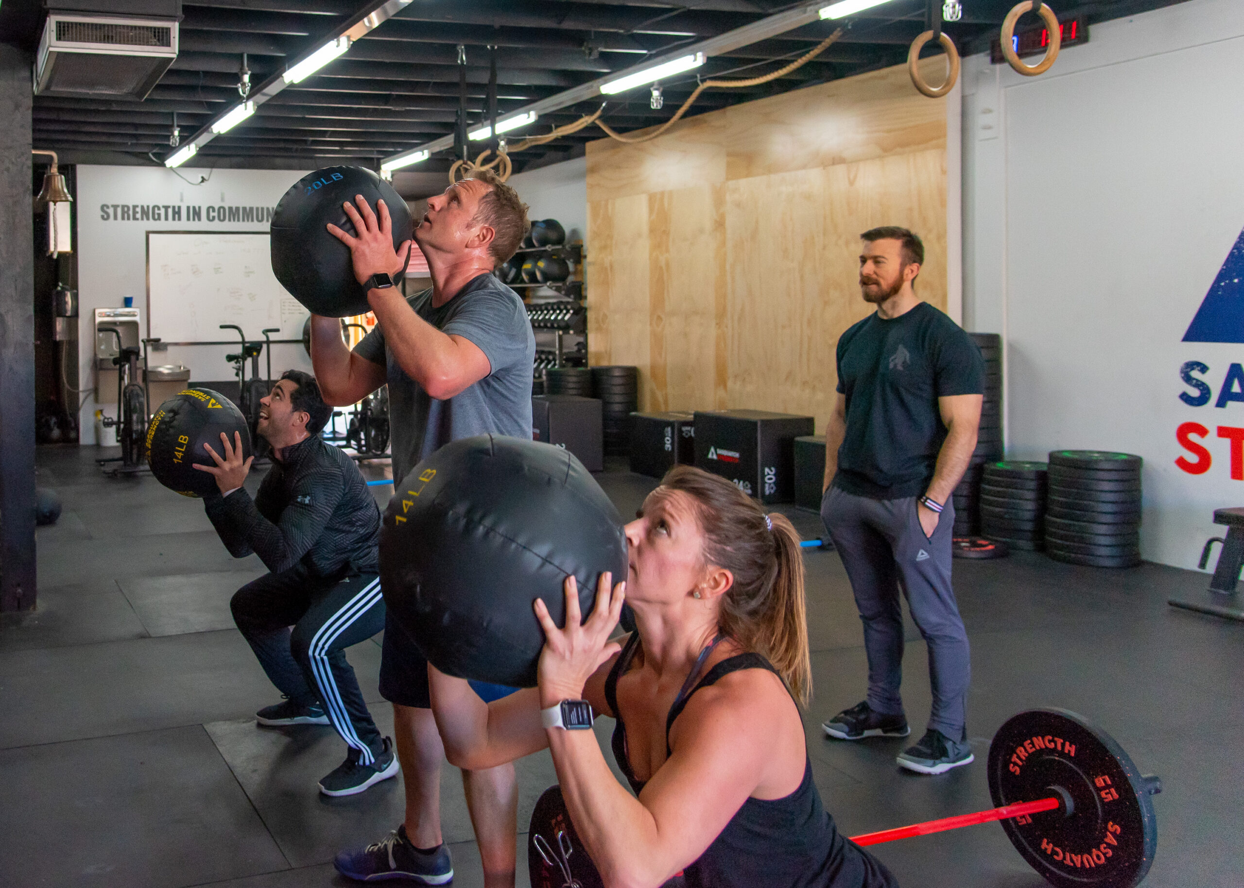 Adults training together in a strength and weightlifting session at Sasquatch Strength
