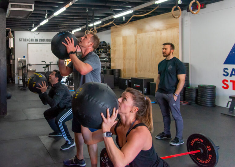 Group of adults strength training together at Sasquatch Strength